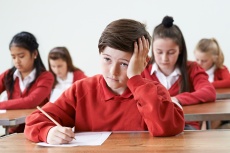 Male Pupil Finding School Exam Difficult